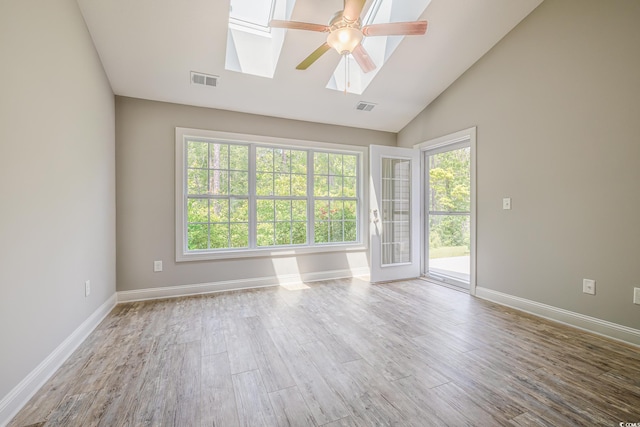 648 Sunnyside Dr Unit 102, Murrells Inlet, SC 29576 - spare room featuring a skylight, a ceiling fan, lofted ceiling, wood finished floors, and baseboards