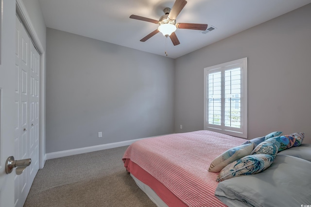 648 Sunnyside Dr Unit 102, Murrells Inlet, SC 29576 - carpeted bedroom with a closet, baseboards, and a ceiling fan
