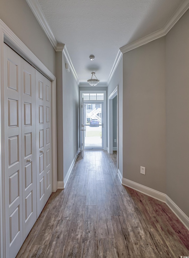 648 Sunnyside Dr Unit 102, Murrells Inlet, SC 29576 - corridor with wood finished floors, ornamental molding, and baseboards