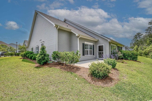 648 Sunnyside Dr Unit 102, Murrells Inlet, SC 29576 - view of side of property featuring a yard and a patio