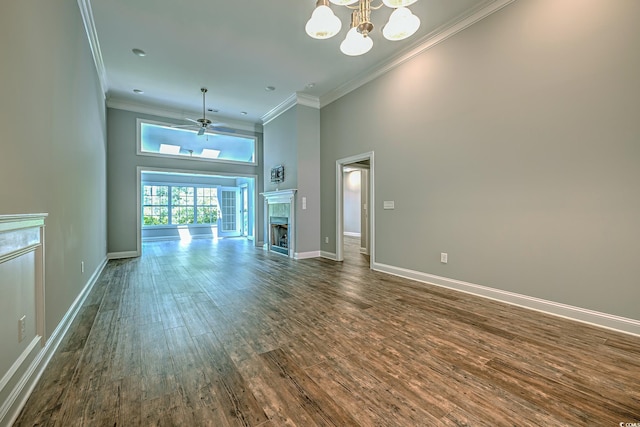648 Sunnyside Dr Unit 102, Murrells Inlet, SC 29576 - unfurnished living room with a towering ceiling, dark wood-type flooring, ornamental molding, a chandelier, and a fireplace