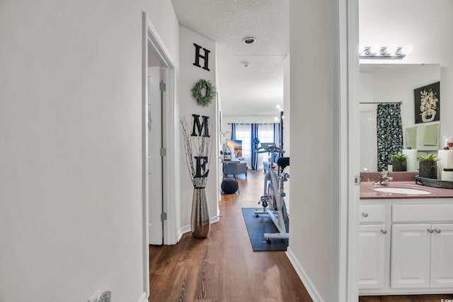 6309 Sweetwater Blvd ., Unit Murrells Inlet, SC 29576 - hall featuring a sink, dark wood-style flooring, and baseboards