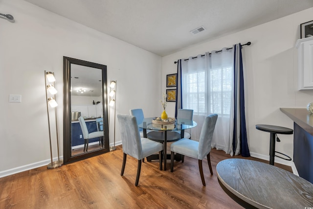 6309 Sweetwater Blvd ., Unit Murrells Inlet, SC 29576 - dining area with light wood-style floors and baseboards