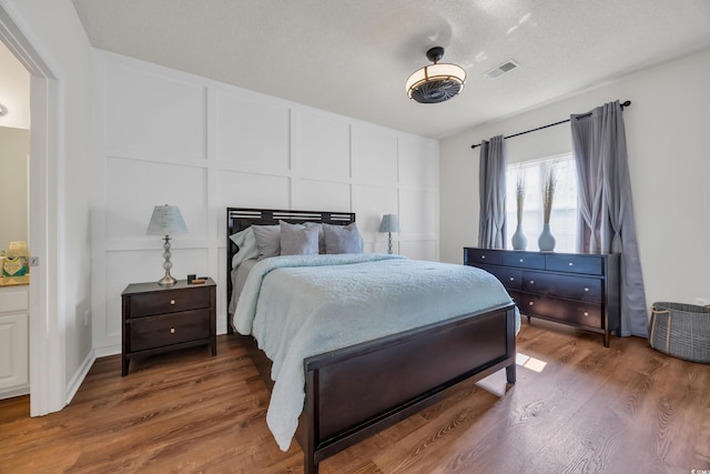 6309 Sweetwater Blvd ., Unit Murrells Inlet, SC 29576 - bedroom featuring a decorative wall and wood finished floors