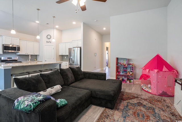 409 Spring View Ct, Little River, SC 29566 - living area featuring ceiling fan, light wood-style flooring, baseboards, and recessed lighting