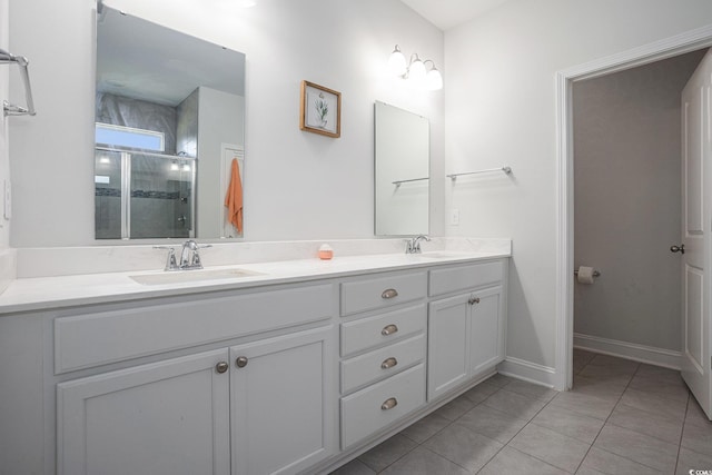 409 Spring View Ct, Little River, SC 29566 - full bathroom with double vanity, tile patterned flooring, a shower stall, and baseboards