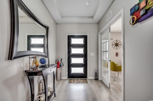 5013 Sassari St, Myrtle Beach, SC 29579 - entryway with wood finished floors, a tray ceiling, and baseboards