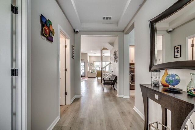 5013 Sassari St, Myrtle Beach, SC 29579 - corridor with light wood finished floors, washer / dryer, and baseboards