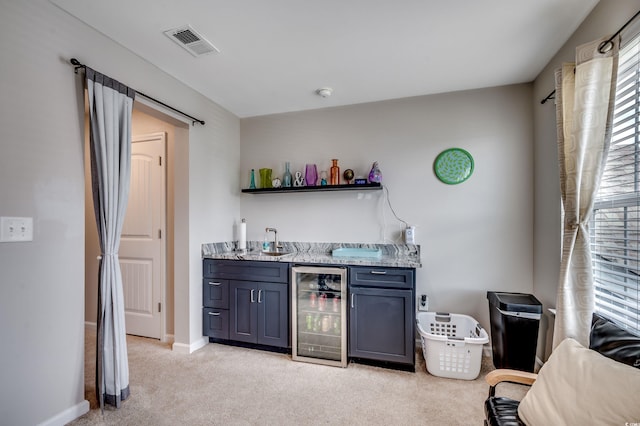 5013 Sassari St, Myrtle Beach, SC 29579 - indoor wet bar with beverage cooler, light carpet, and baseboards