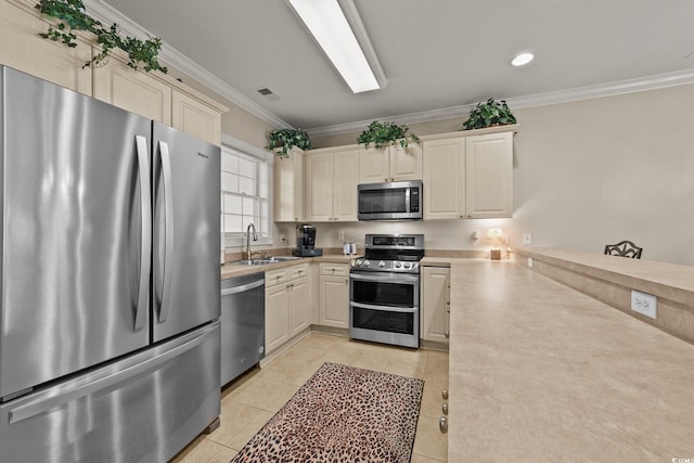 4878 Luster Leaf Cir Unit 102, Myrtle Beach, SC 29577 - kitchen with appliances with stainless steel finishes, crown molding, light countertops, a sink, and light tile patterned flooring