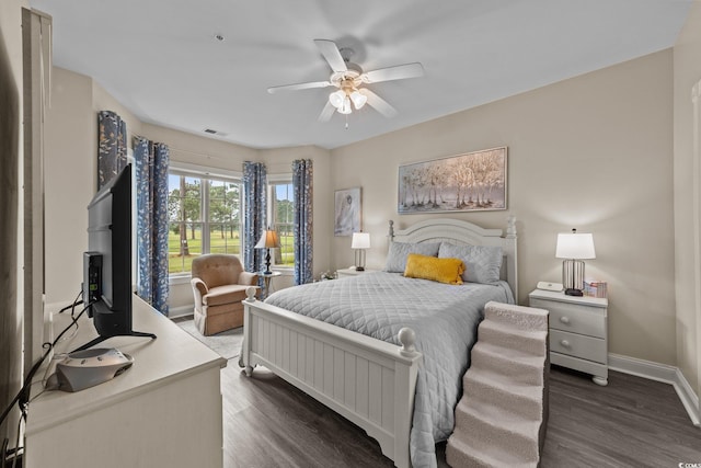 4878 Luster Leaf Cir Unit 102, Myrtle Beach, SC 29577 - bedroom featuring dark wood-style flooring, baseboards, and a ceiling fan