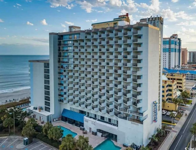 2001 S Ocean Blvd Unit 1109, Myrtle Beach, SC 29575 - view of building exterior featuring a water view and uncovered parking