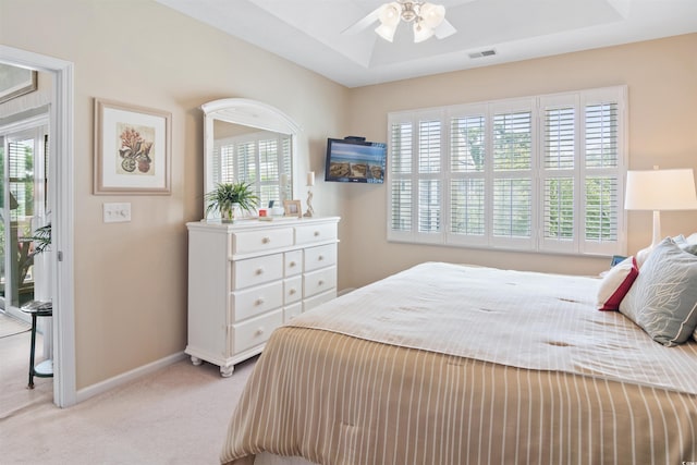 601 Hillside Dr N Unit 1931, North Myrtle Beach, SC 29582 - bedroom with light colored carpet, multiple windows, baseboards, and ceiling fan