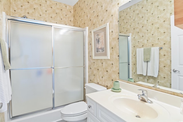 601 Hillside Dr N Unit 1931, North Myrtle Beach, SC 29582 - bathroom with wallpapered walls, toilet, a shower with door, and vanity