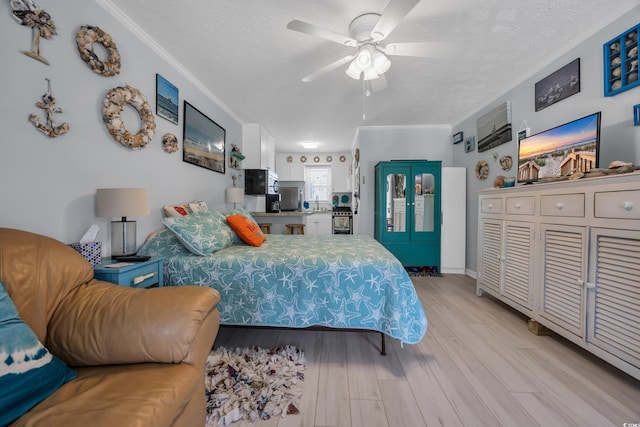5909 N Ocean Blvd Unit 18, North Myrtle Beach, SC 29582 - bedroom with ornamental molding, light wood-style floors, a textured ceiling, refrigerator, and ceiling fan