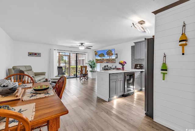 1870 Auburn Dr Unit 22A, Surfside Beach, SC 29575 - kitchen featuring wine cooler, gray cabinets, light countertops, ceiling fan, and light wood-style flooring