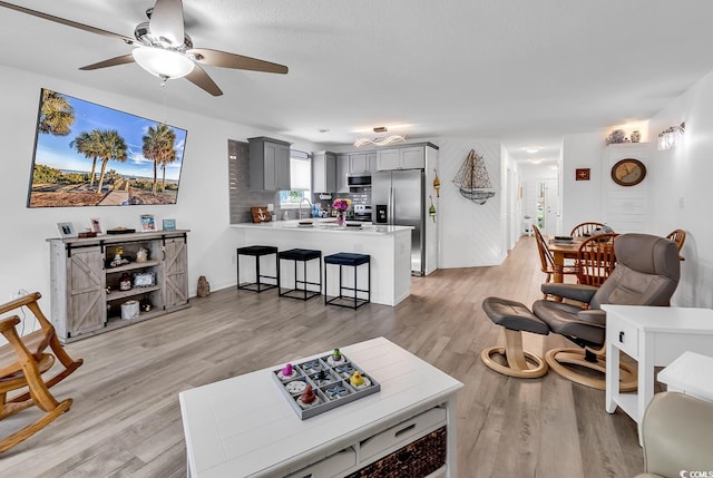 1870 Auburn Dr Unit 22A, Surfside Beach, SC 29575 - living area featuring a ceiling fan and light wood-type flooring