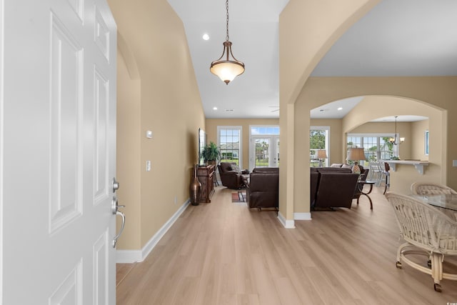 1149 6th Ave S, North Myrtle Beach, SC 29582 - foyer entrance with arched walkways, light wood-style floors, baseboards, recessed lighting, and vaulted ceiling