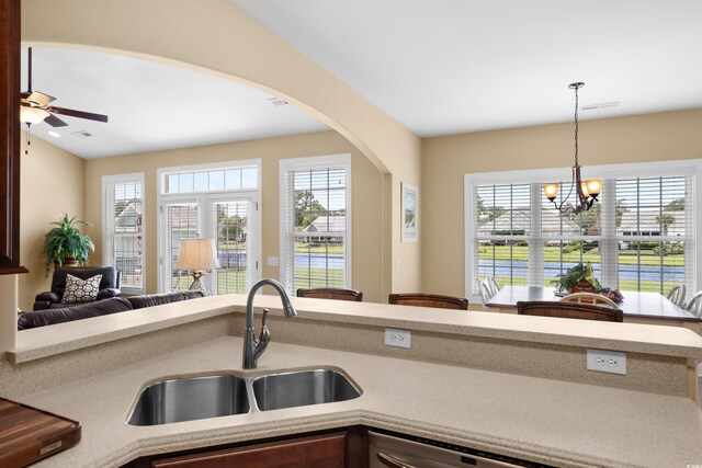 1149 6th Ave S, North Myrtle Beach, SC 29582 - kitchen featuring a sink, ceiling fan, arched walkways, and healthy amount of natural light
