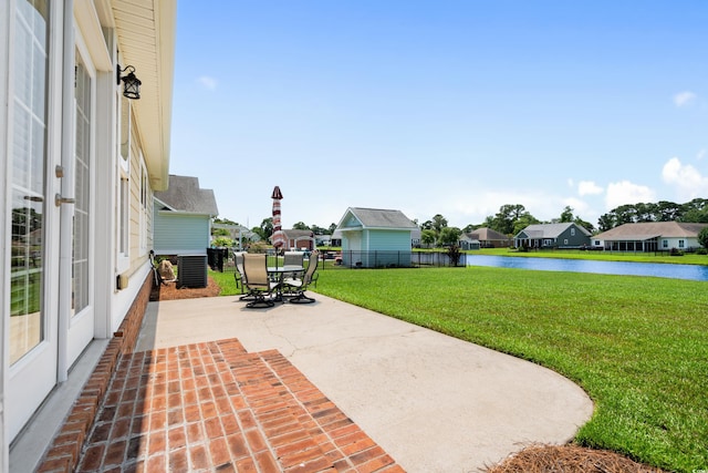 1149 6th Ave S, North Myrtle Beach, SC 29582 - view of patio / terrace featuring a water view, cooling unit, outdoor dining area, a residential view, and french doors