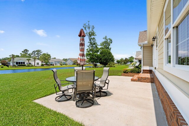 1149 6th Ave S, North Myrtle Beach, SC 29582 - view of patio / terrace with a water view and outdoor dining space
