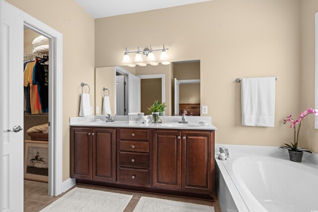 1149 6th Ave S, North Myrtle Beach, SC 29582 - full bathroom with tile patterned floors, a bath, double vanity, and a walk in closet