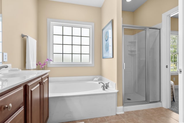 1149 6th Ave S, North Myrtle Beach, SC 29582 - bathroom featuring a stall shower, a garden tub, vanity, and tile patterned flooring