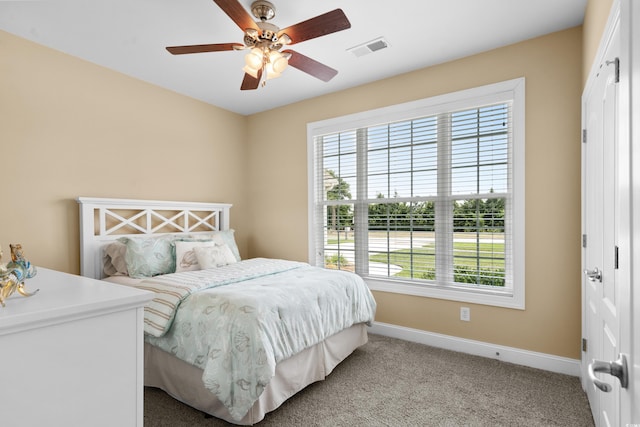 1149 6th Ave S, North Myrtle Beach, SC 29582 - bedroom featuring baseboards, light colored carpet, and ceiling fan