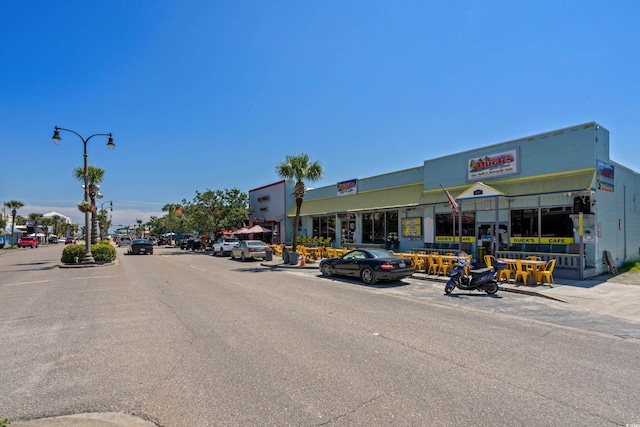 1149 6th Ave S, North Myrtle Beach, SC 29582 - view of asphalt road featuring street lighting, sidewalks, and curbs
