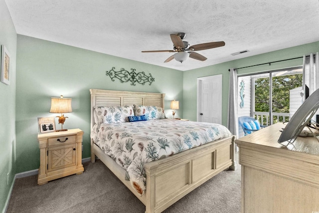 117 Pinehurst Ln Unit 5-J, Pawleys Island, SC 29585 - bedroom with light carpet, baseboards, ceiling fan, a textured ceiling, and access to outside