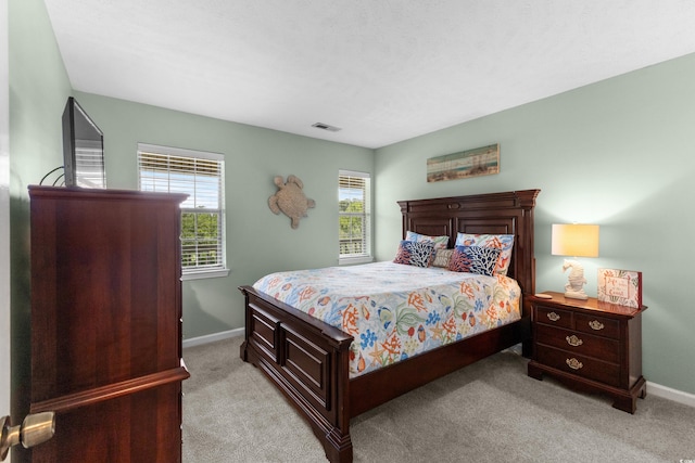 117 Pinehurst Ln Unit 5-J, Pawleys Island, SC 29585 - bedroom with light colored carpet and baseboards