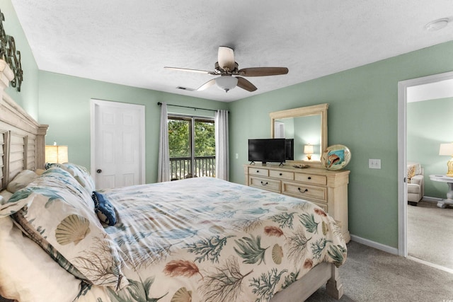 117 Pinehurst Ln Unit 5-J, Pawleys Island, SC 29585 - bedroom with access to exterior, carpet, ceiling fan, baseboards, and a textured ceiling