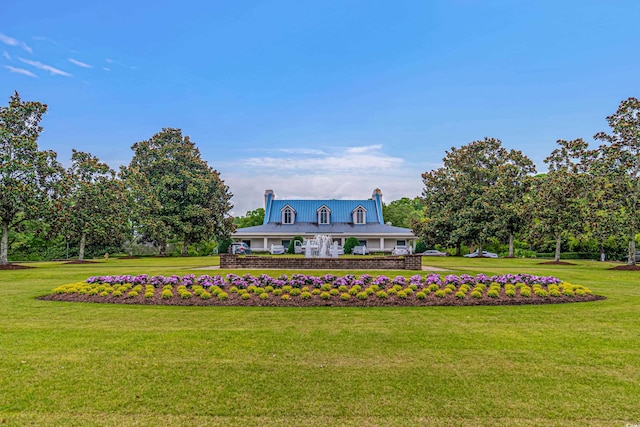 117 Pinehurst Ln Unit 5-J, Pawleys Island, SC 29585 - view of front of property with a chimney and a front lawn