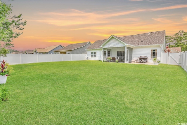 832 Windsor Rose Dr, Conway, SC 29526 - back of house at dusk with roof with shingles, a patio, and a gate