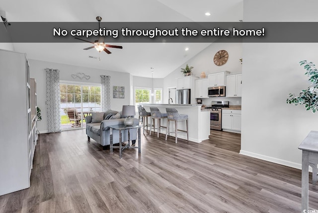 832 Windsor Rose Dr, Conway, SC 29526 - living area with ceiling fan, high vaulted ceiling, baseboards, wood finished floors, and recessed lighting