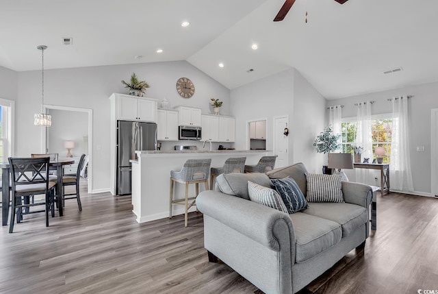 832 Windsor Rose Dr, Conway, SC 29526 - living area with high vaulted ceiling, ceiling fan, light wood-style flooring, recessed lighting, and a chandelier