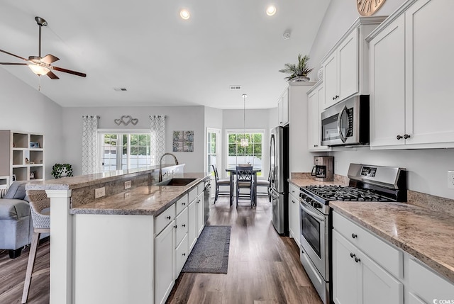 832 Windsor Rose Dr, Conway, SC 29526 - kitchen with stainless steel appliances, a sink, dark wood-style flooring, a kitchen breakfast bar, and an island with sink