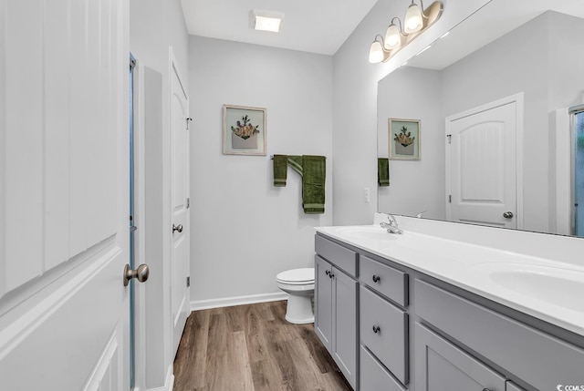 832 Windsor Rose Dr, Conway, SC 29526 - full bathroom with double vanity, wood finished floors, toilet, and baseboards