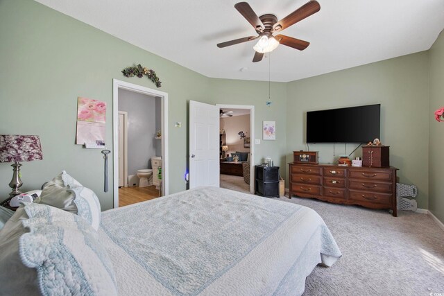 155 Lazy Willow Ln Unit 103, Myrtle Beach, SC 29572 - bedroom featuring light carpet, baseboards, a ceiling fan, and ensuite bath