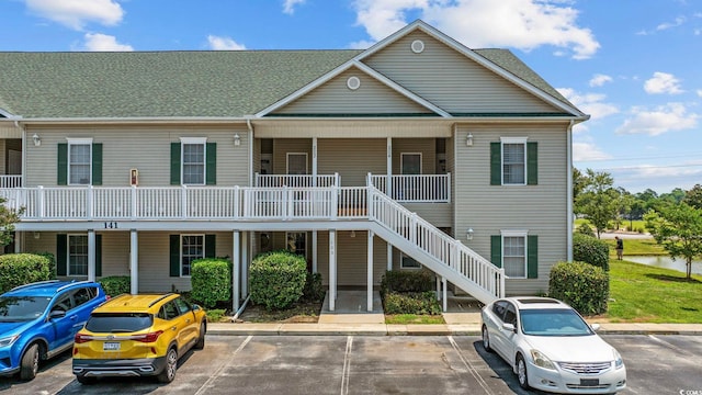 155 Lazy Willow Ln Unit 103, Myrtle Beach, SC 29572 - view of property with uncovered parking and stairway