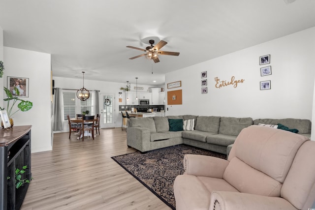 136 Southbury Dr, Myrtle Beach, SC 29588 - living room with light wood-style floors, a ceiling fan, and a chandelier