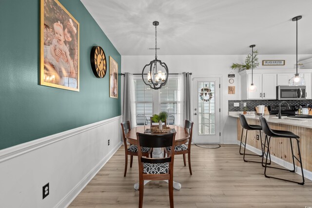 136 Southbury Dr, Myrtle Beach, SC 29588 - dining space featuring a chandelier and light wood-type flooring