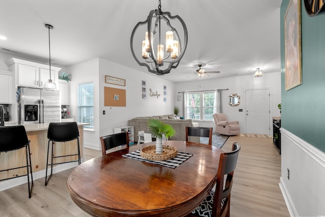 136 Southbury Dr, Myrtle Beach, SC 29588 - dining room with a chandelier, ceiling fan, and light wood finished floors