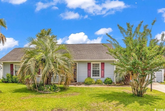 405 Flagstone Dr, Myrtle Beach, SC 29588 - view of front of house with a front yard and a shingled roof