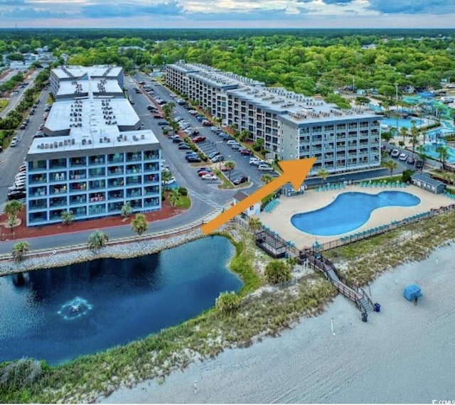 5905 S Kings Hwy Unit 206A, Myrtle Beach, SC 29575 - bird's eye view of a pool, apartment complex / building, and a nearby body of water