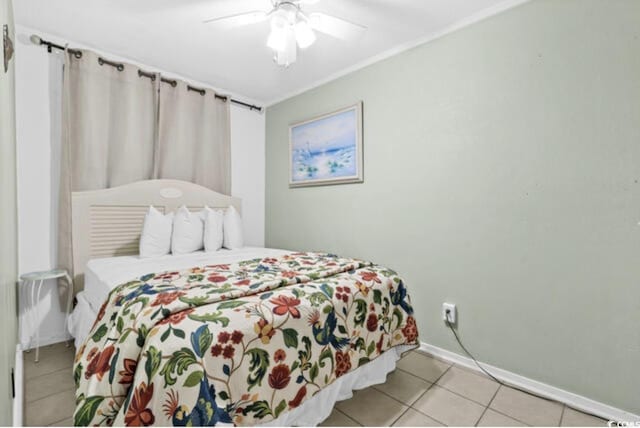5905 S Kings Hwy Unit 206A, Myrtle Beach, SC 29575 - bedroom with light tile patterned flooring, baseboards, and a ceiling fan