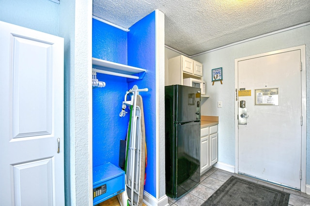 1207 S Ocean Blvd Unit 51012, Myrtle Beach, SC 29577 - interior space with a textured ceiling and light tile patterned flooring