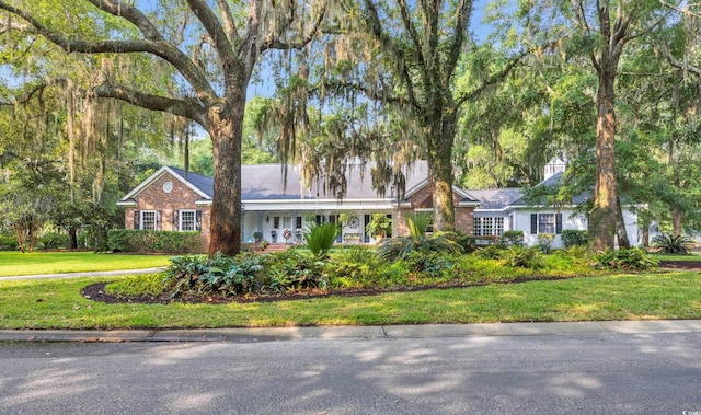 1259 Oatland Lake Rd, Pawleys Island, SC 29585 - ranch-style house featuring a front lawn