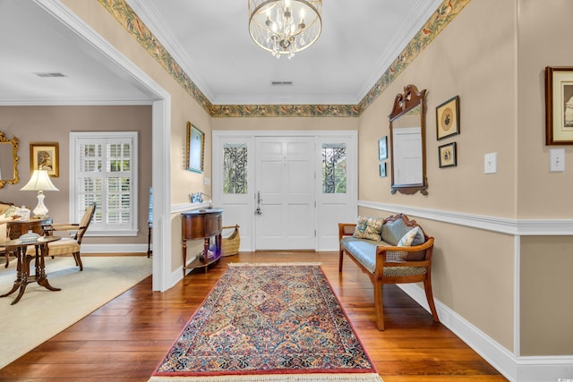 1259 Oatland Lake Rd, Pawleys Island, SC 29585 - foyer with a chandelier, hardwood / wood-style flooring, and crown molding