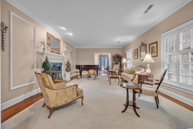 1259 Oatland Lake Rd, Pawleys Island, SC 29585 - living room featuring wood finished floors, plenty of natural light, a high end fireplace, and crown molding